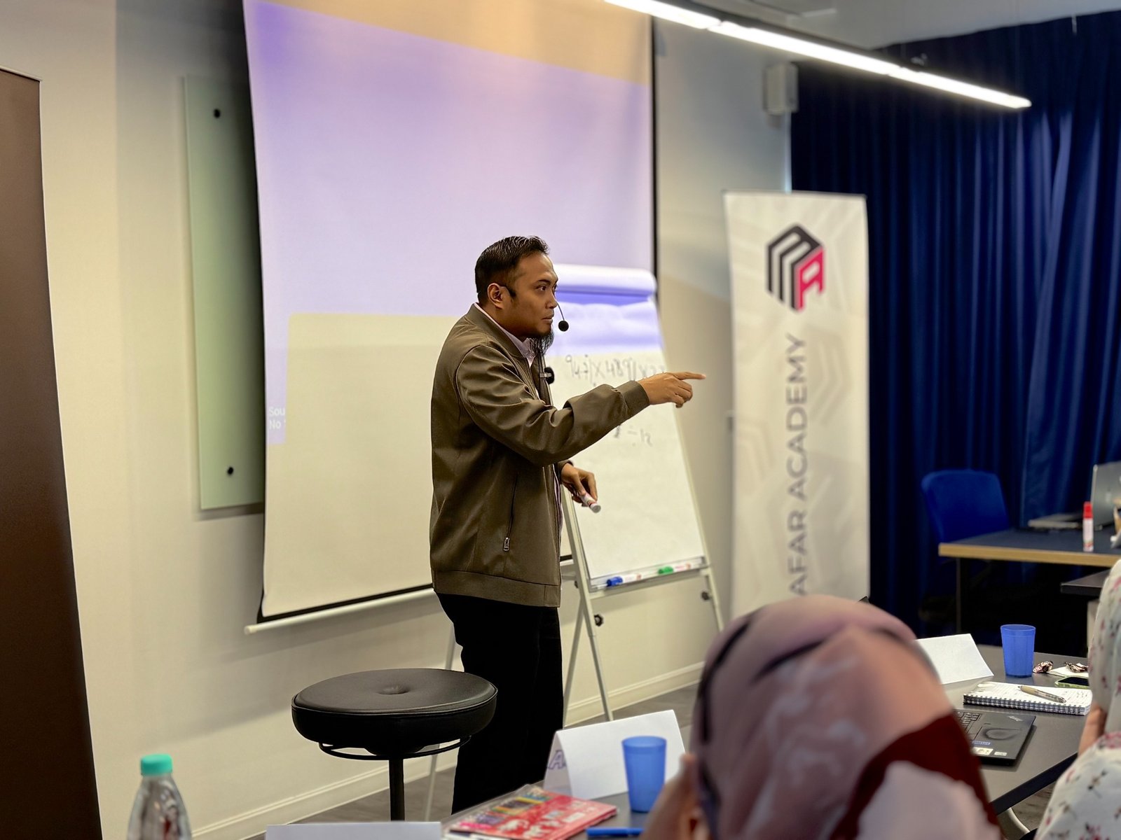 Trainer leading an interactive MAFAR Academy workshop